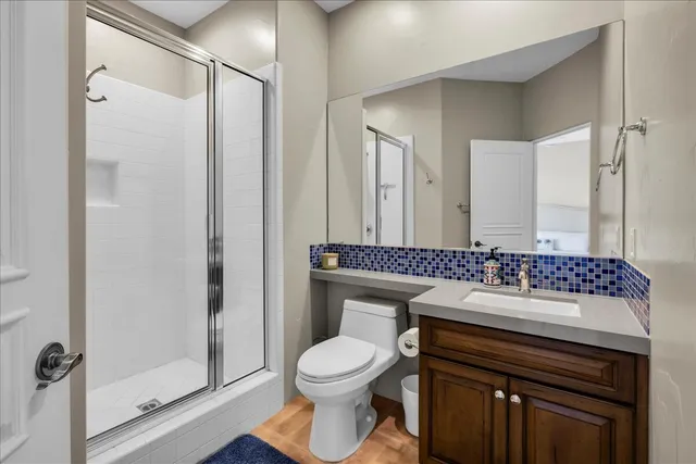 a bathroom with a sink toilet and shower