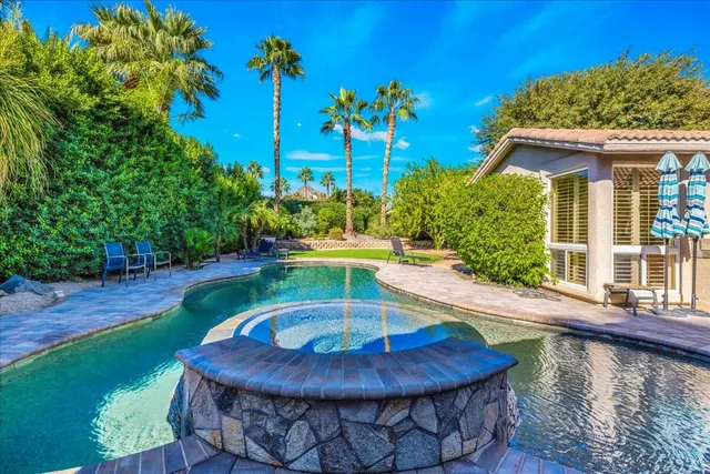 a view of a swimming pool with a patio