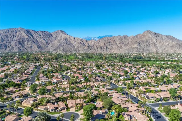 an aerial view of residential house and car parked