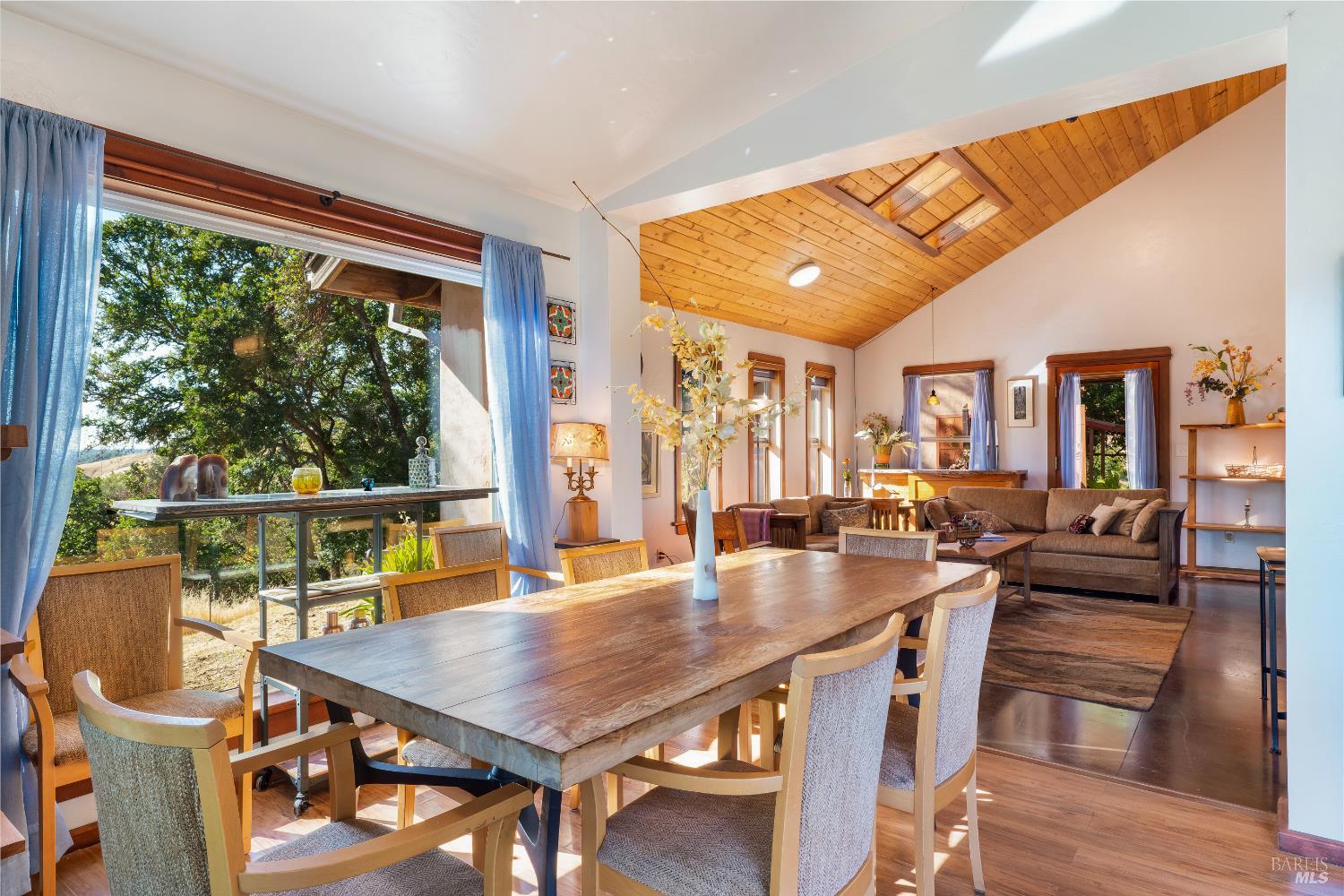 13635 Denmark Creek Road Boonville, CA 95415 - Photo 12 of 75 a dining room with furniture a rug and wooden floor