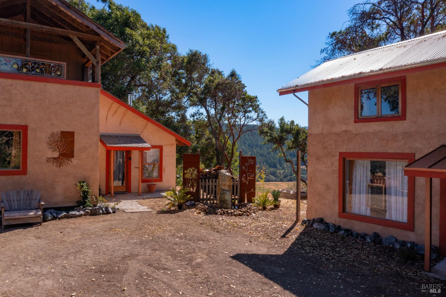 13635 Denmark Creek Road Boonville, CA 95415 - Photo 3 of 75 a view of house with backyard space and porch