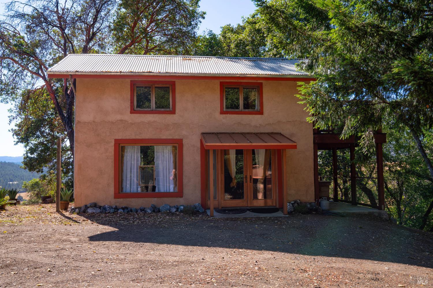 13635 Denmark Creek Road Boonville, CA 95415 - Photo 32 of 75 a front view of a house with a yard