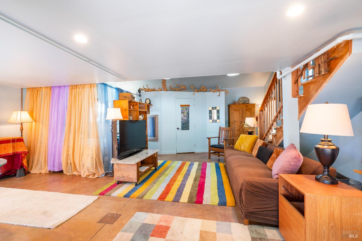 13635 Denmark Creek Road Boonville, CA 95415 - Photo 34 of 75 a bedroom with furniture and a flat screen tv