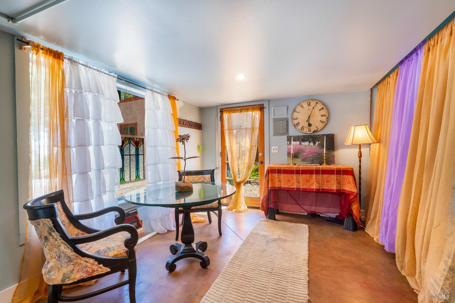 13635 Denmark Creek Road Boonville, CA 95415 - Photo 35 of 75 a bedroom with a bed and a chandelier