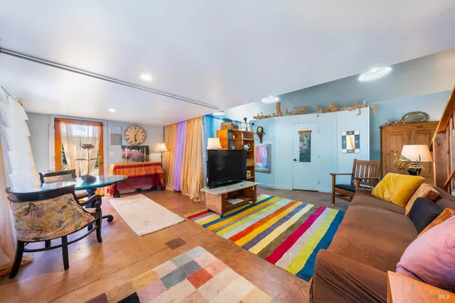 a house view with a sitting space and garden