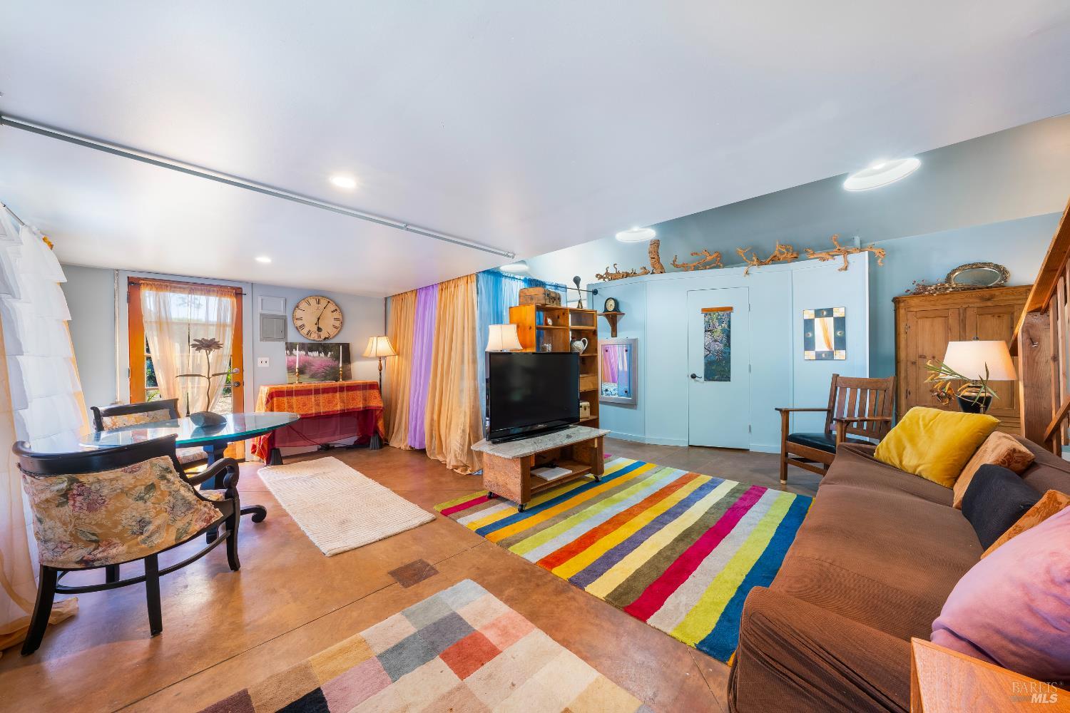 13635 Denmark Creek Road Boonville, CA 95415 - Photo 36 of 75 a living room with furniture and a flat screen tv