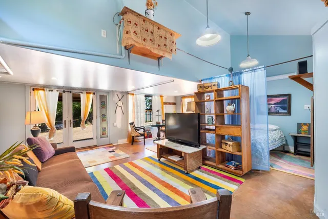 a backyard of a house with table and chairs