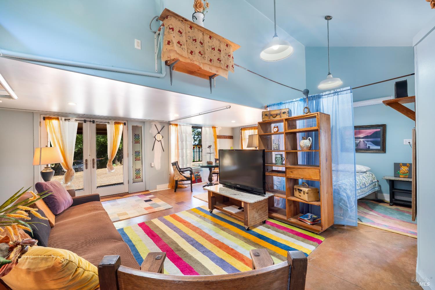 13635 Denmark Creek Road Boonville, CA 95415 - Photo 38 of 75 a living room with furniture and a flat screen tv