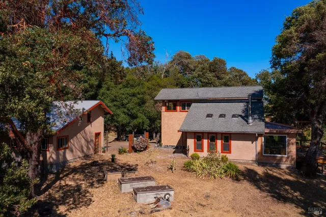 a outdoor living space with furniture and a fireplace
