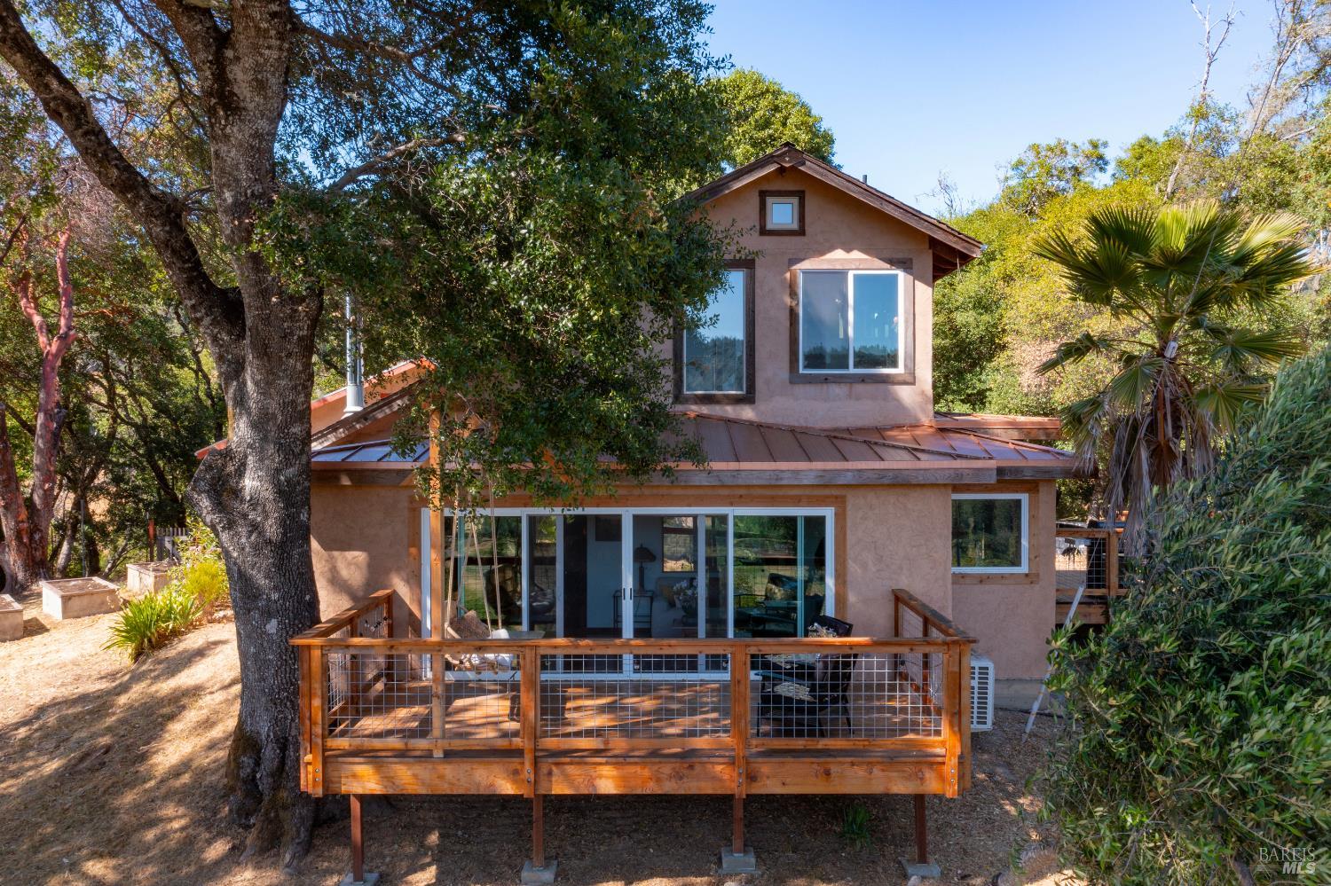13635 Denmark Creek Road Boonville, CA 95415 - Photo 45 of 75 a house view with a sitting space and garden