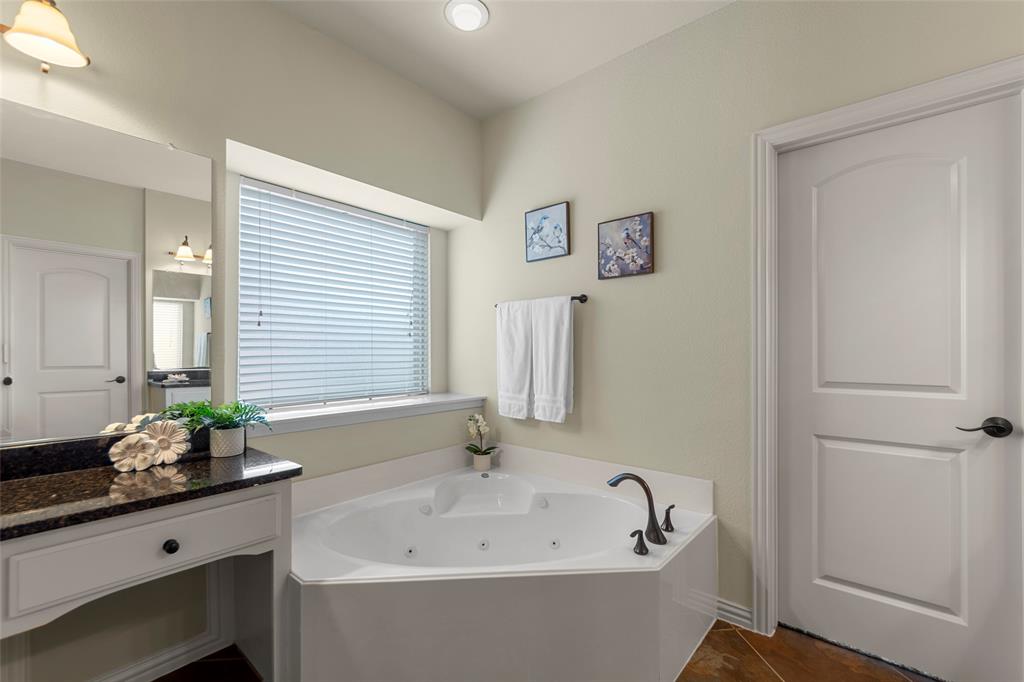 5143 Stream Crest Way Fairview, TX 75069 - Photo 19 of 35 Bathroom with a tub with jets and vanity