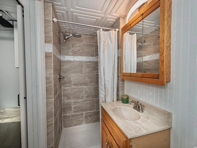 a bathroom with a sink and a mirror