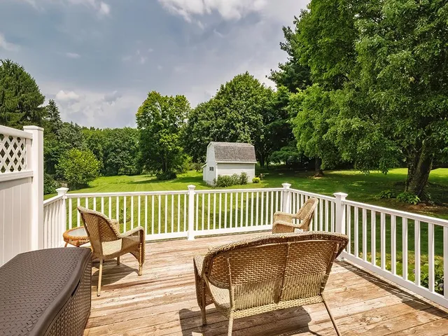 a view of a chair and table on the deck