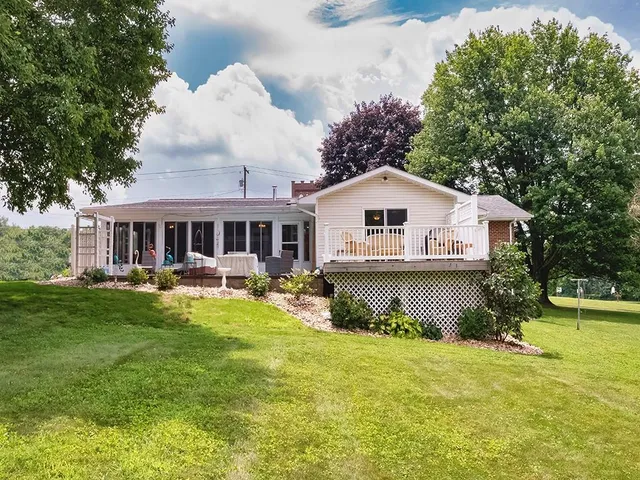 a front view of a house with swimming pool