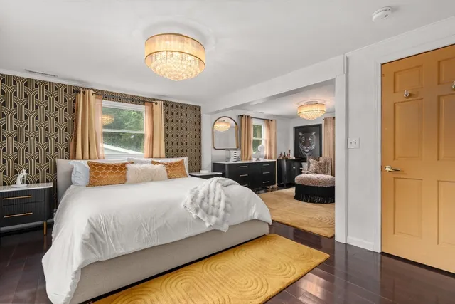 a view of a house with a yard and sitting area