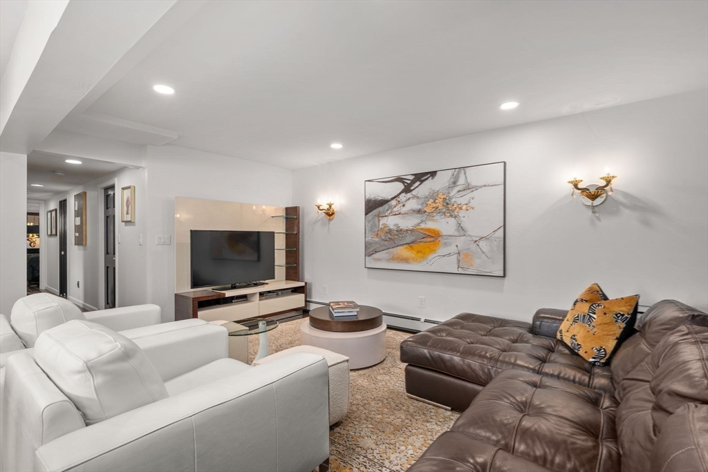 188 Atlantic Street Gloucester, MA 01930 - Photo 13 of 29 a living room with furniture and a flat screen tv