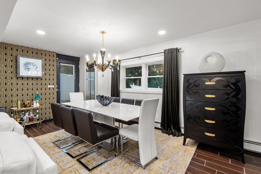 188 Atlantic Street Gloucester, MA 01930 - Photo 15 of 29 a view of a dining room with furniture and chandelier