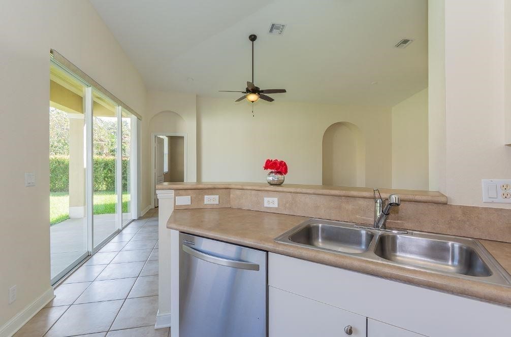 5825 Spanish River Road Fort Pierce, FL 34951 - Photo 11 of 36 a kitchen with a sink and faucet