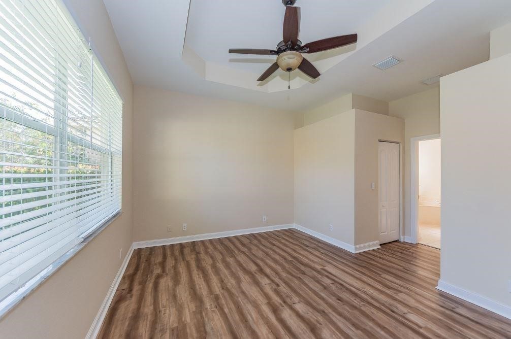 5825 Spanish River Road Fort Pierce, FL 34951 - Photo 12 of 36 a view of room with hardwood floor and window