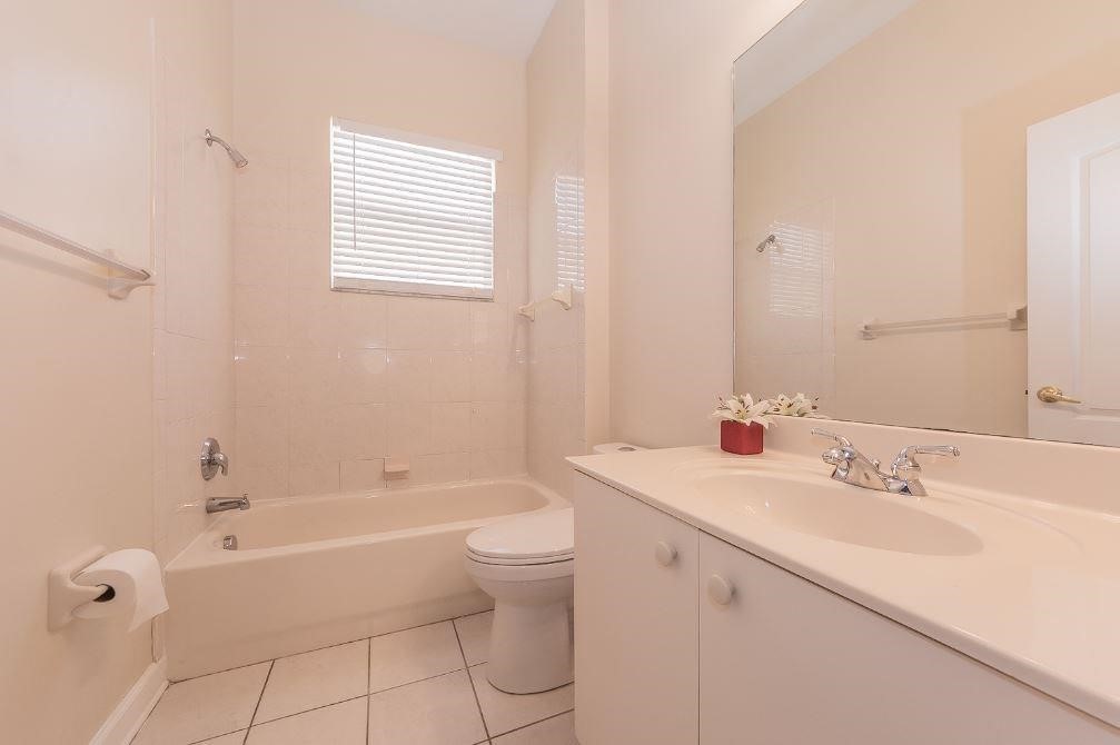 5825 Spanish River Road Fort Pierce, FL 34951 - Photo 18 of 36 a bathroom with a sink a toilet and shower