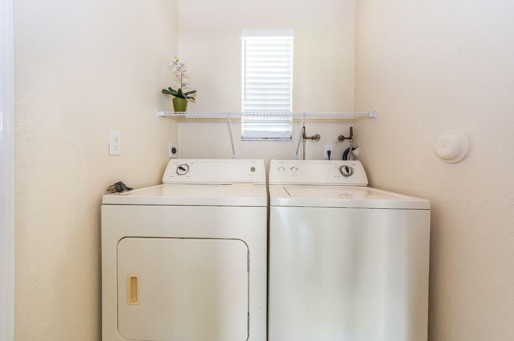 5825 Spanish River Road Fort Pierce, FL 34951 - Photo 21 of 36 a utility room with dryer and washer