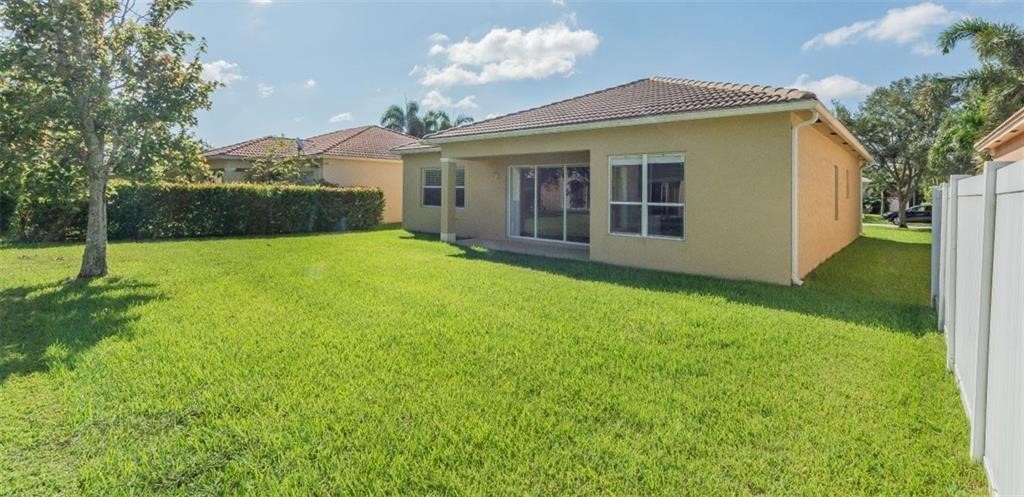 5825 Spanish River Road Fort Pierce, FL 34951 - Photo 24 of 36 a view of a house with a backyard
