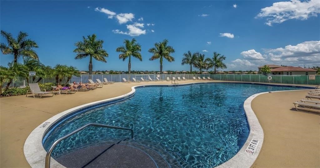 5825 Spanish River Road Fort Pierce, FL 34951 - Photo 32 of 36 a view of a swimming pool with a yard