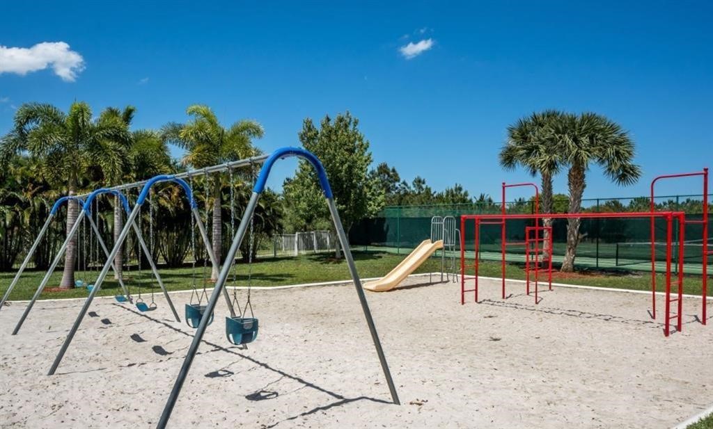 5825 Spanish River Road Fort Pierce, FL 34951 - Photo 35 of 36 a view of a park with swings and slide