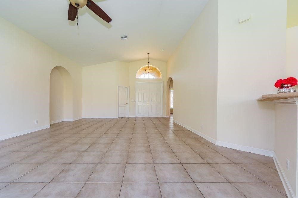 5825 Spanish River Road Fort Pierce, FL 34951 - Photo 4 of 36 a view of empty room with wooden floor