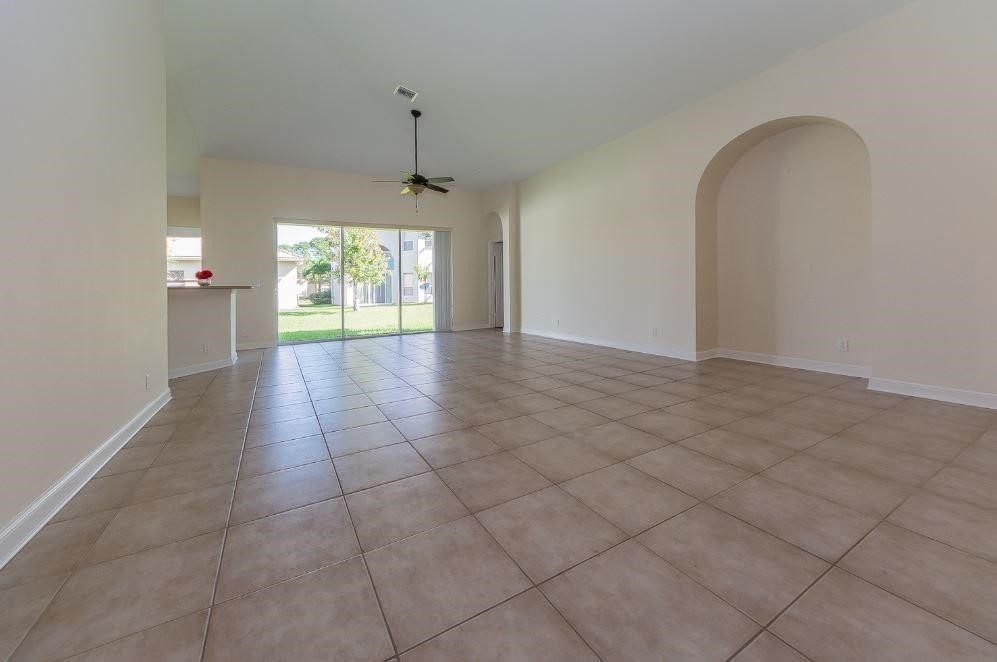 5825 Spanish River Road Fort Pierce, FL 34951 - Photo 5 of 36 an empty room with windows and outdoor view