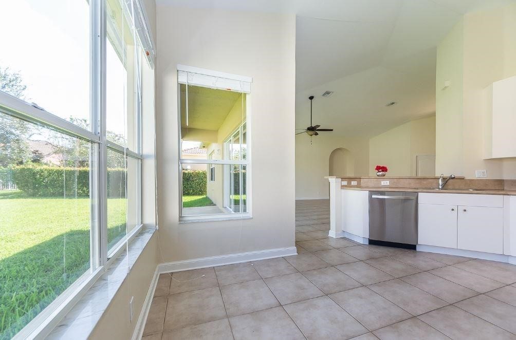 5825 Spanish River Road Fort Pierce, FL 34951 - Photo 10 of 36 a open kitchen with a sink and dishwasher stove top oven