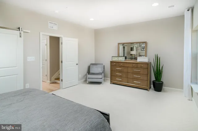 a bedroom with a bed and a cabinets
