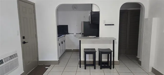 a kitchen with a sink and a stove