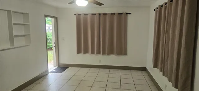a view of a livingroom with a chair and a flat screen tv