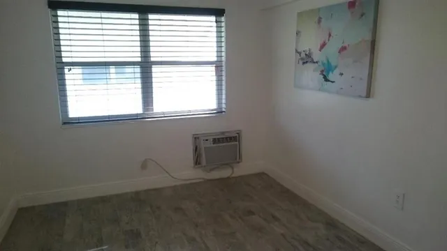 a view of an empty room with a window