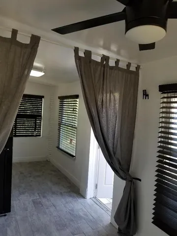 a kitchen with a stove and white cabinets