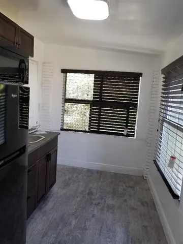 a view of a hallway with workspace