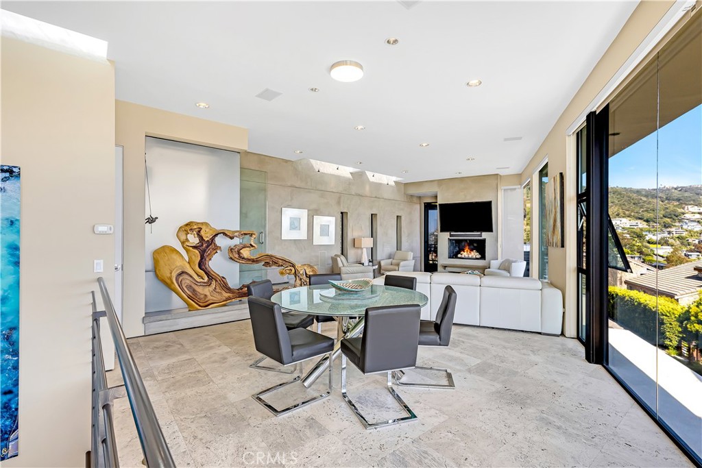 31411 Ceanothus Drive Laguna Beach, CA 92651 - Photo 13 of 60 a view of a dining room with furniture a rug and wooden floor