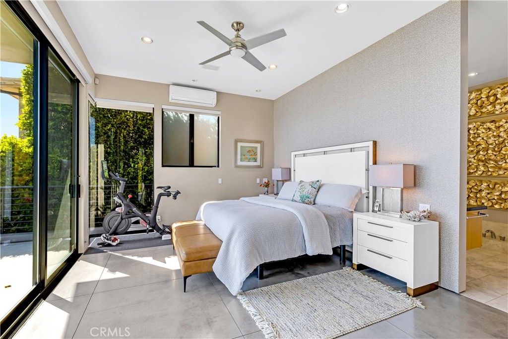 31411 Ceanothus Drive Laguna Beach, CA 92651 - Photo 20 of 60 a bedroom with a bed lamp and a large window