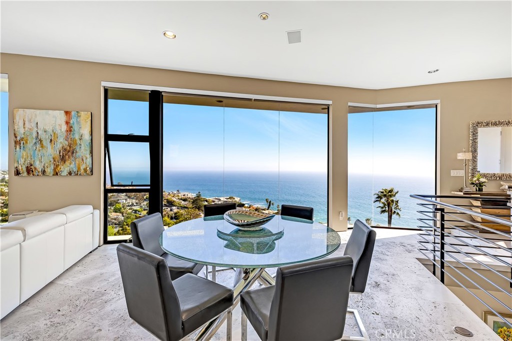 31411 Ceanothus Drive Laguna Beach, CA 92651 - Photo 33 of 60 a view of a dining room with furniture and a potted plant