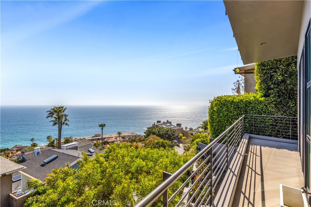 31411 Ceanothus Drive Laguna Beach, CA 92651 - Photo 43 of 60 a view of a balcony with wooden floor and potted plants