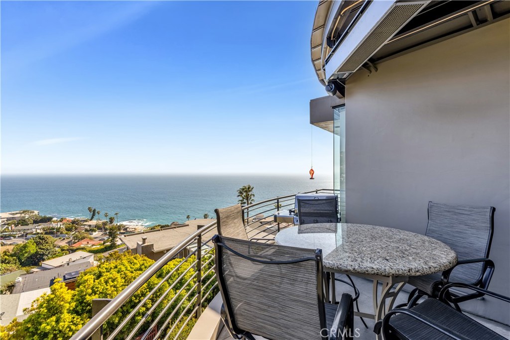 31411 Ceanothus Drive Laguna Beach, CA 92651 - Photo 48 of 60 a view of a balcony with a table and chairs
