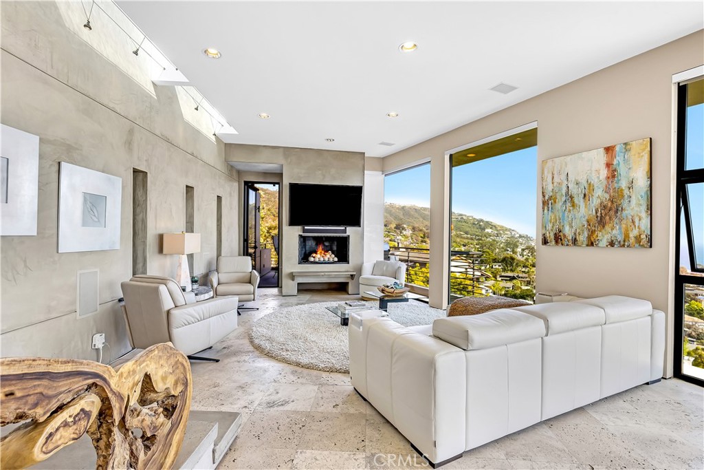 31411 Ceanothus Drive Laguna Beach, CA 92651 - Photo 9 of 60 a living room with furniture large window and a flat screen tv