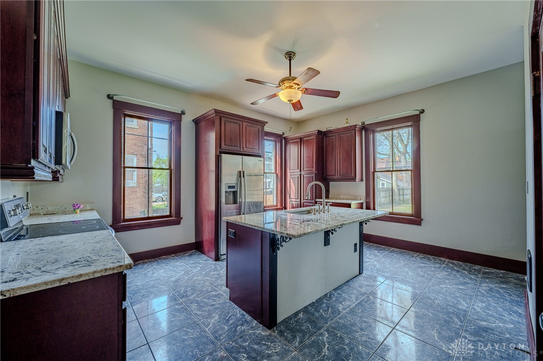 308 Yankee Road Middletown, OH 45044 - Photo 19 of 47 This spacious kitchen offers ample countertop space and a large island, perfect for culinary endeavors.