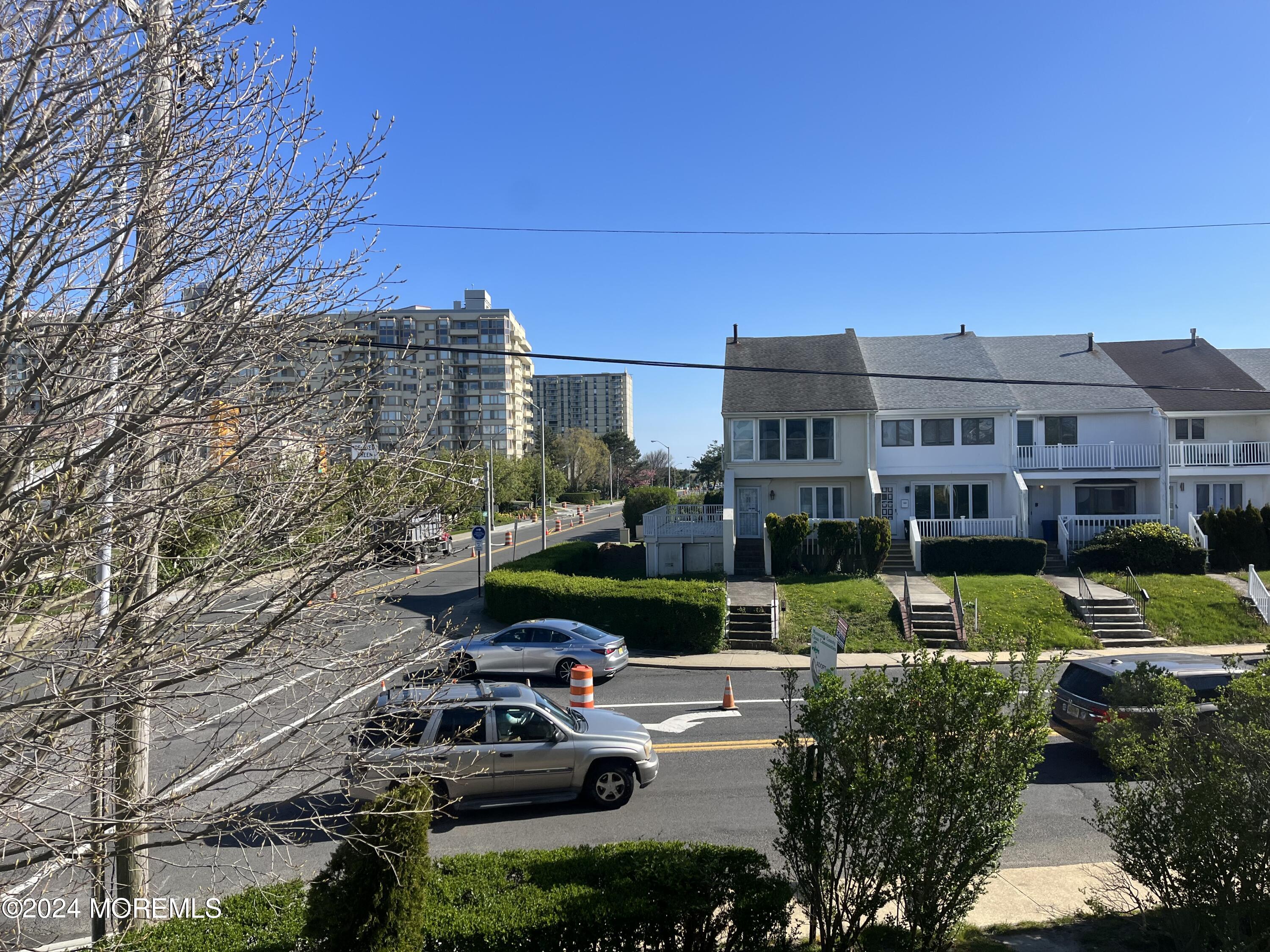 3 Cedar Avenue, Unit UPSTAIRS Long Branch, NJ 07740 - Photo 11 of 14 a view of a house with a garden