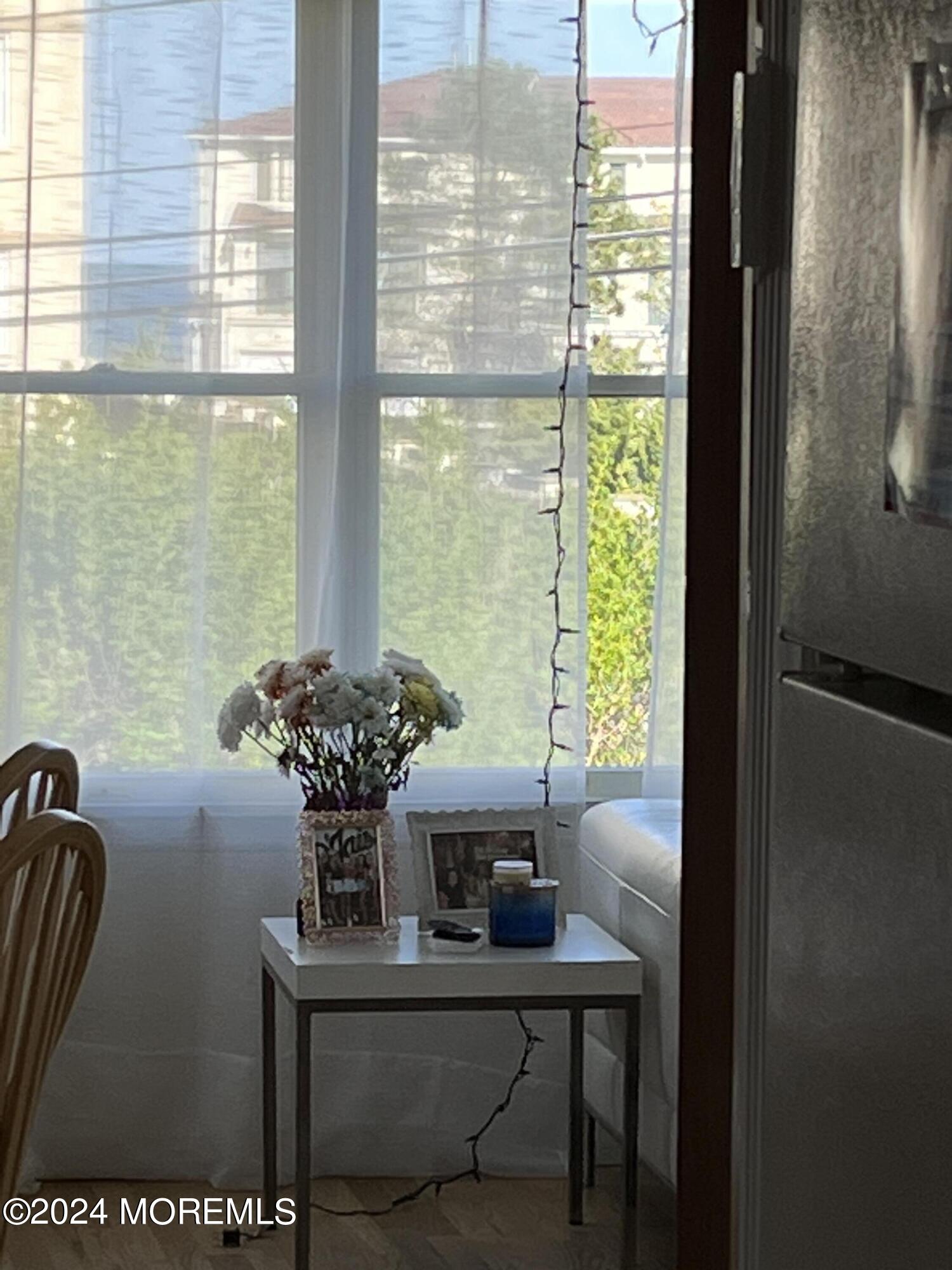 3 Cedar Avenue, Unit UPSTAIRS Long Branch, NJ 07740 - Photo 13 of 14 a view of a dining room with furniture window and outside view