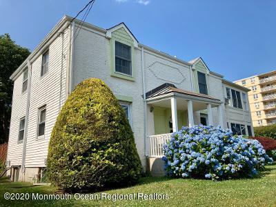 3 Cedar Avenue, Unit UPSTAIRS Long Branch, NJ 07740 - Photo 2 of 14 a front view of a house with a garden