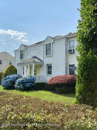 a view of a house with a garden