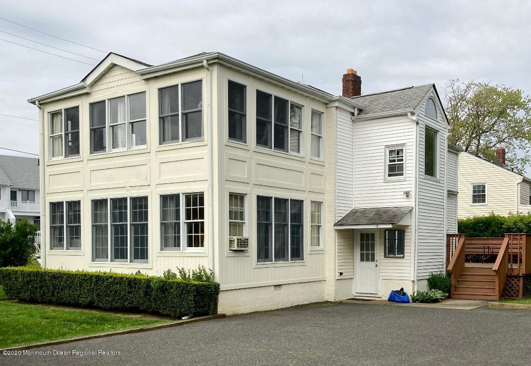 3 Cedar Avenue, Unit UPSTAIRS Long Branch, NJ 07740 - Photo 6 of 14 a front view of a house with a yard