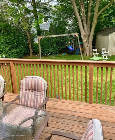a view of roof deck with furniture